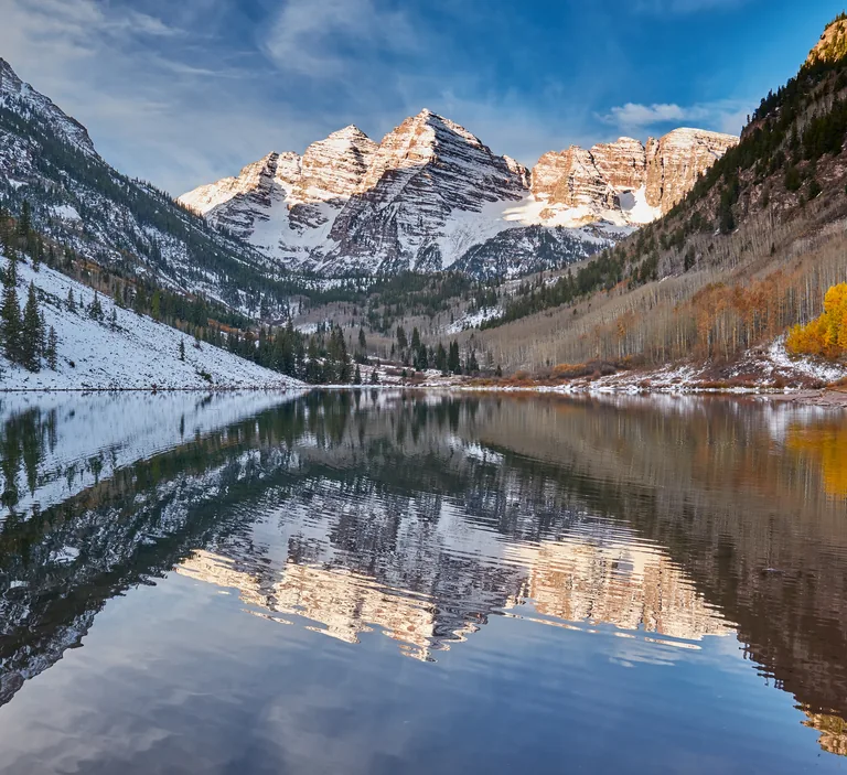 The Maroon Bells peaks reflected in an alpine lake near Aspen, Colorado